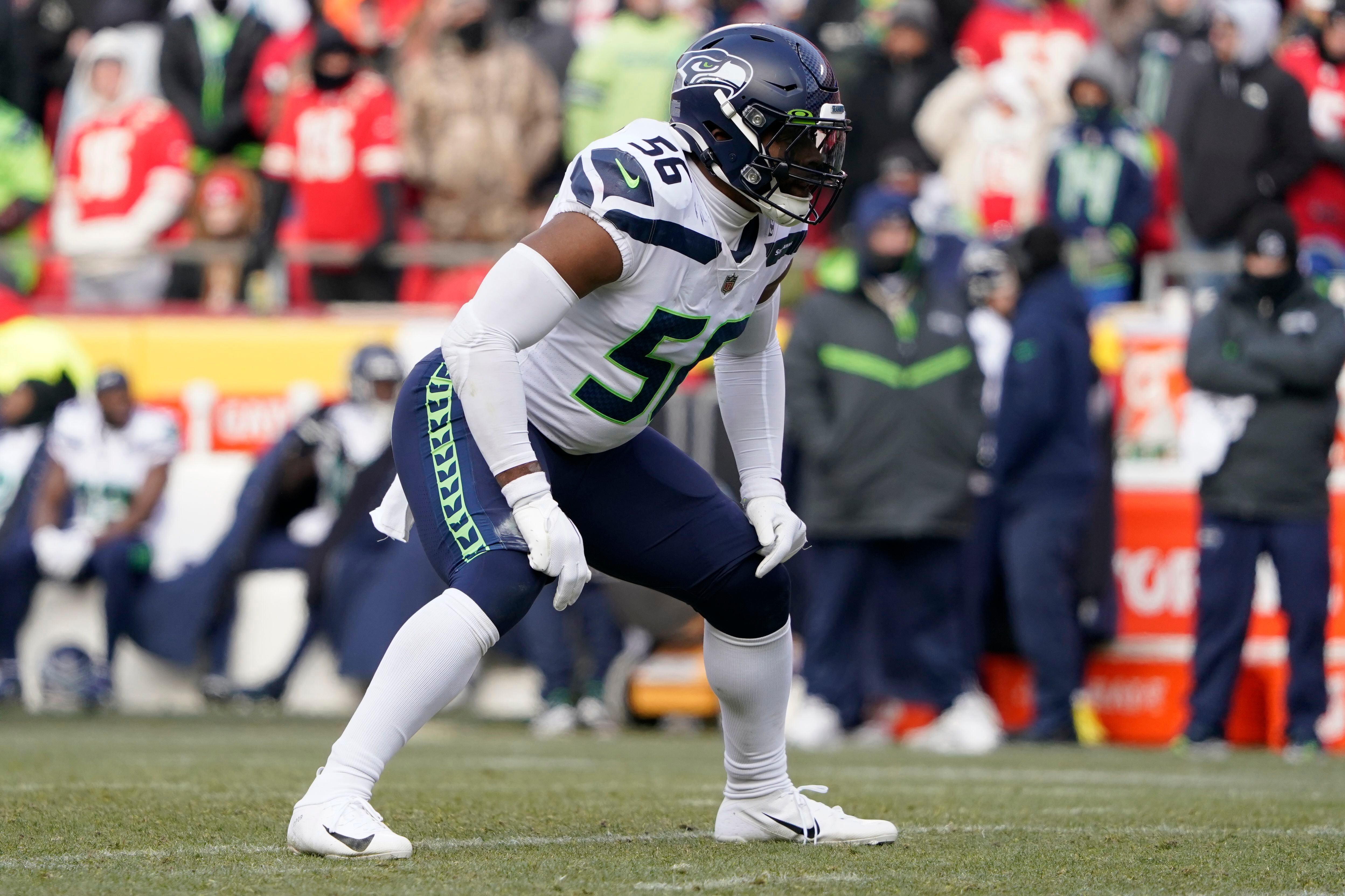 Seattle Seahawks' Jordyn Brooks (56) is tackled by New Orleans Saints'  Lil'Jordan Humphrey after recovering a Saints fumble during the second half  of an NFL football game, Monday, Oct. 25, 2021, in