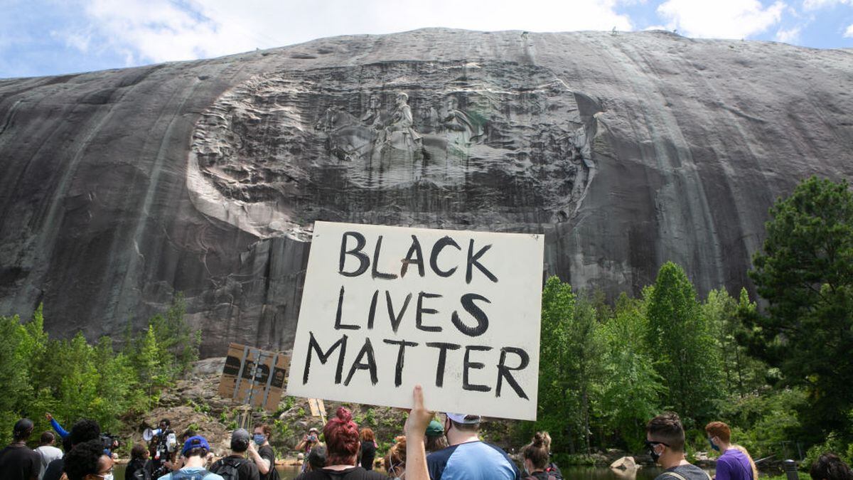 Demonstrators March At Stone Mountain Demanding Removal Of Confederate Carving